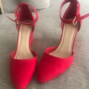 Red wedge strappy heels.
